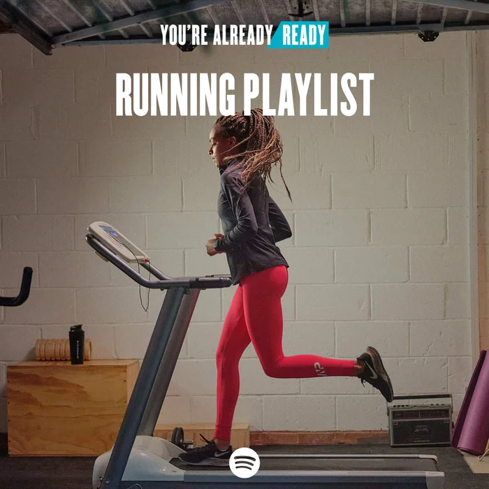 A woman doing a backbend pose on a yoga mat with the words 'You're Already Ready - Yoga Playlist' overlaying.